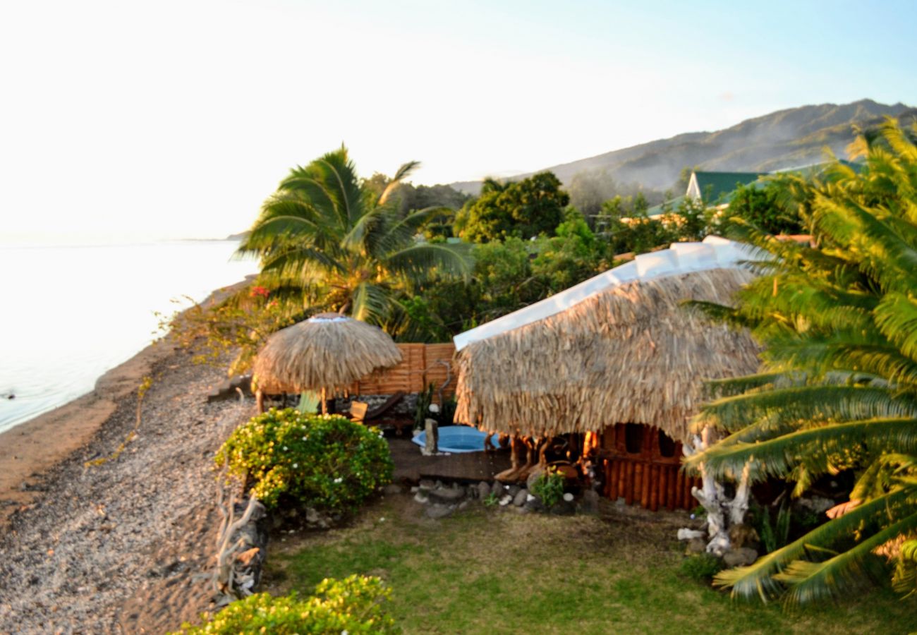 View of the bungalow and the white sandy beach View of the property